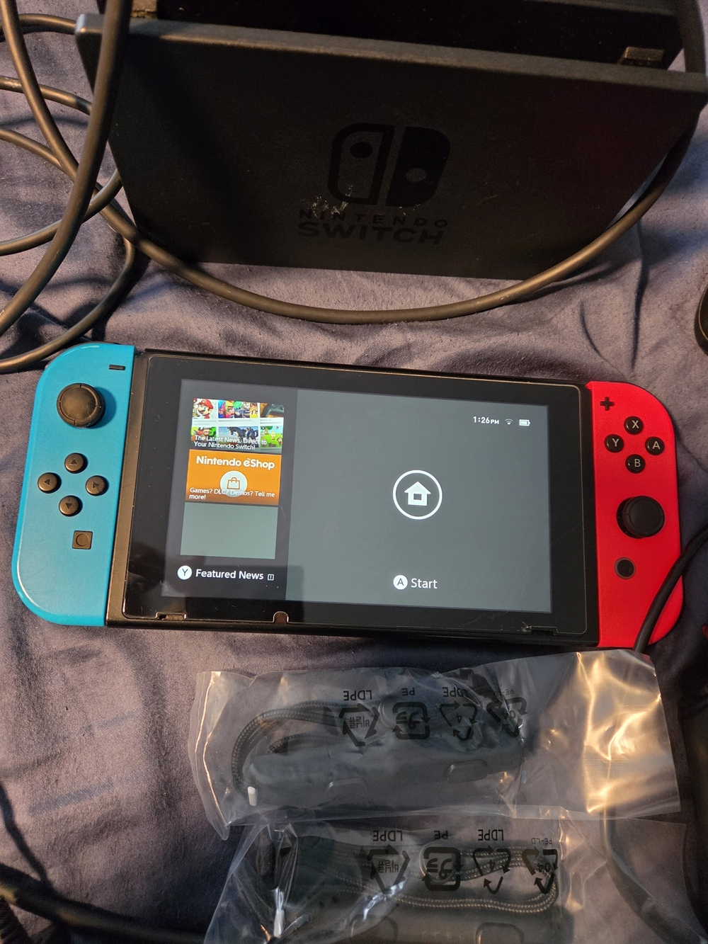Nintendo Switch Console with Neon Blue and Neon Red Joy-Con